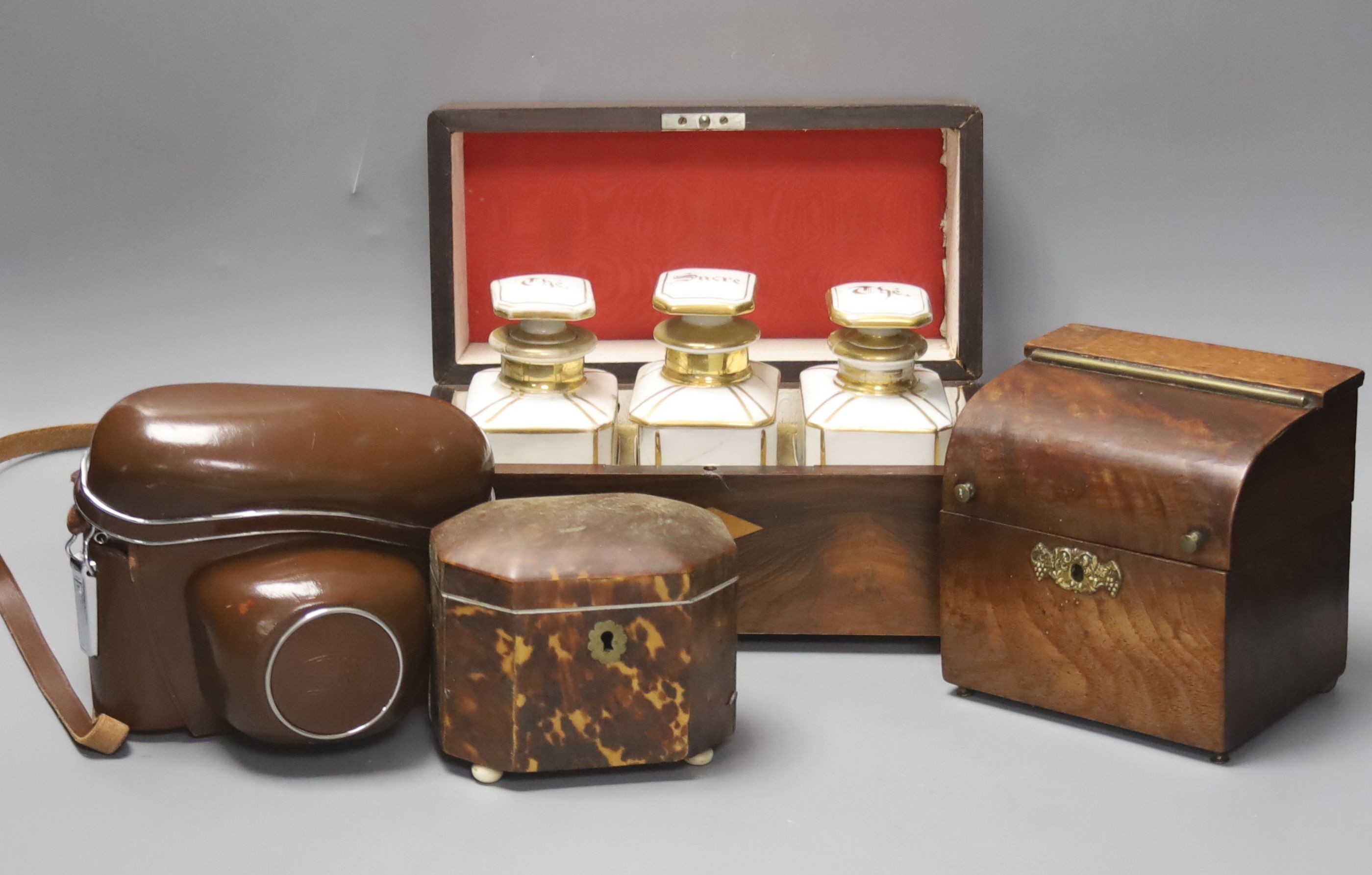 A French rosewood tea caddy, a tortoishell box, a camera and another box